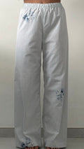 Pantalon carreaux bleu et fleurs